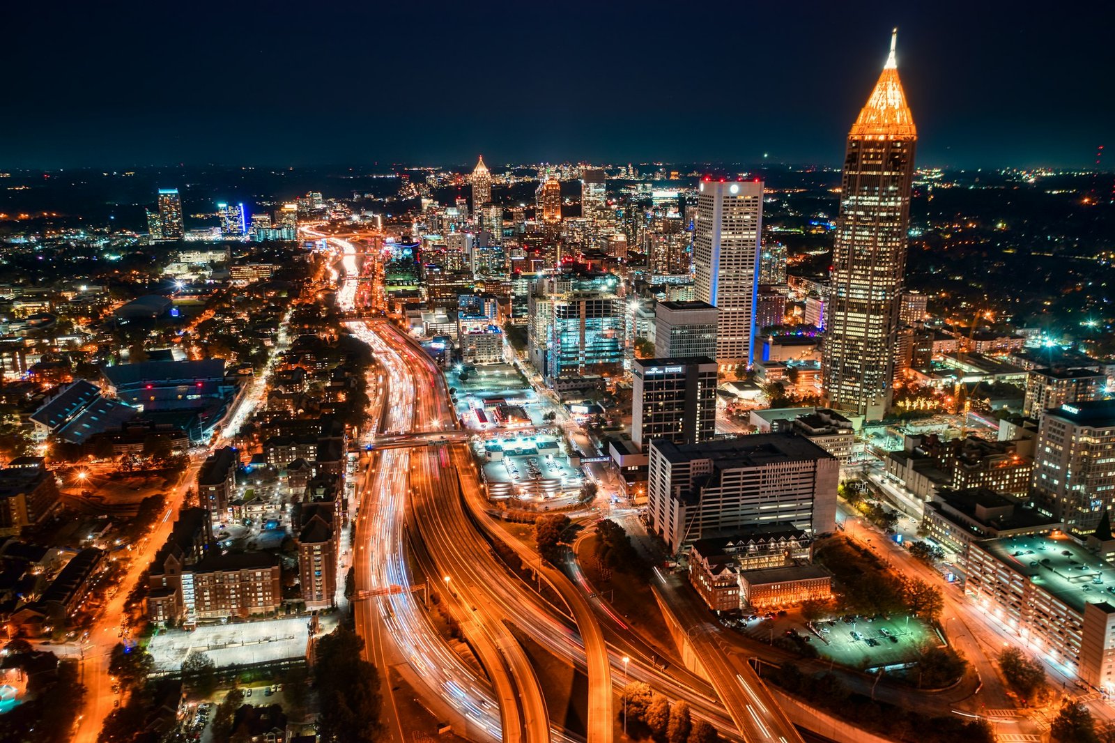 Downtown Atlanta at night from above, with the light trails of the Downtown Connector